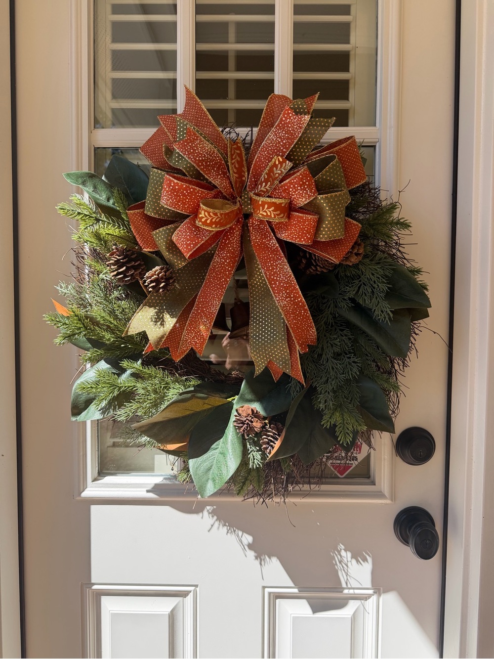 Autumn Magnolia & Pine Holiday Wreath with Orange and Olive Bow